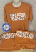 An orange t-shirt with whatever spices your pumpkin on it displayed on a mannequin.